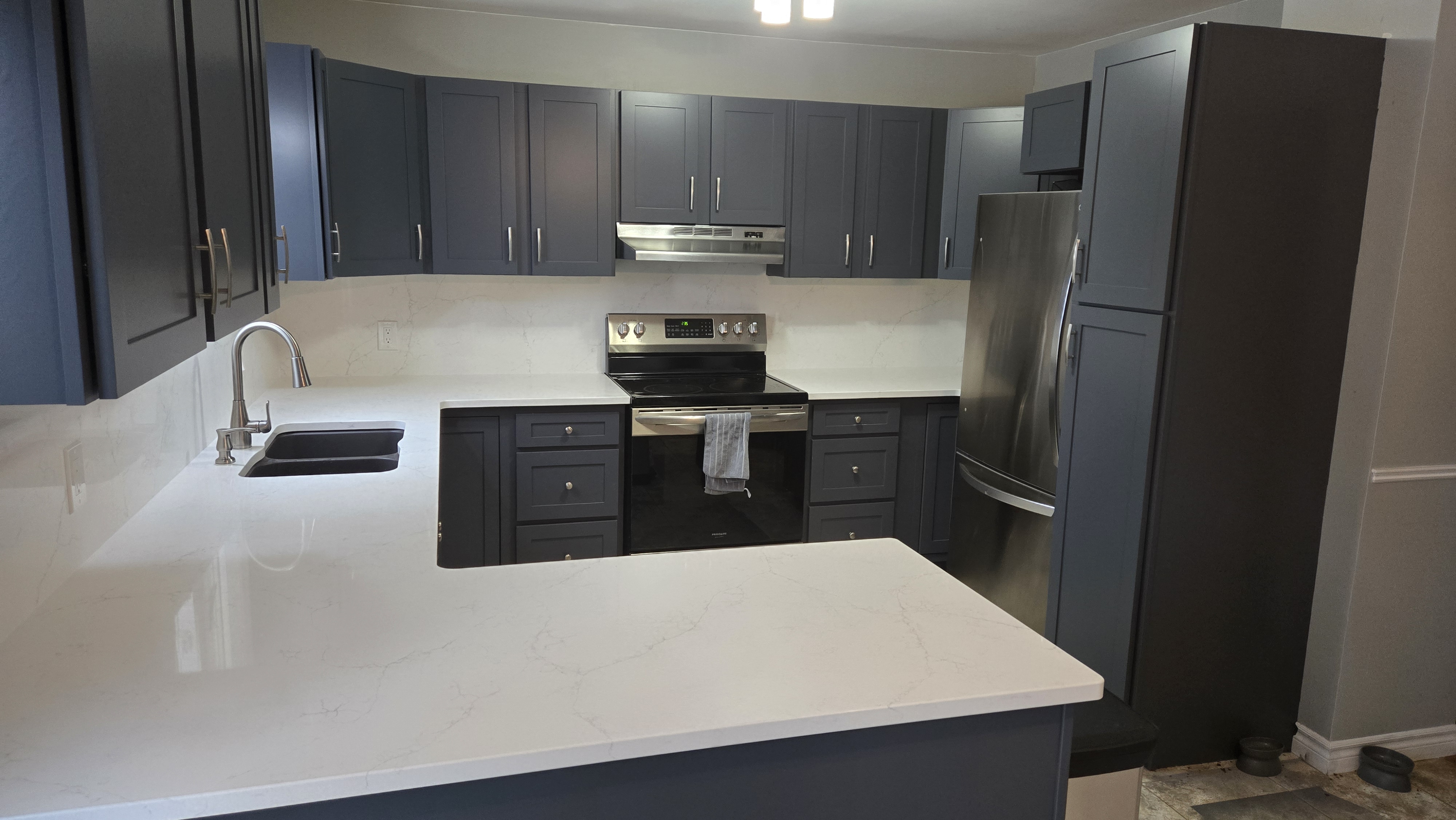 blue shaker with quartz countertop